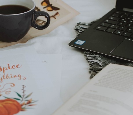 Book blogger set up with computer book and coffee